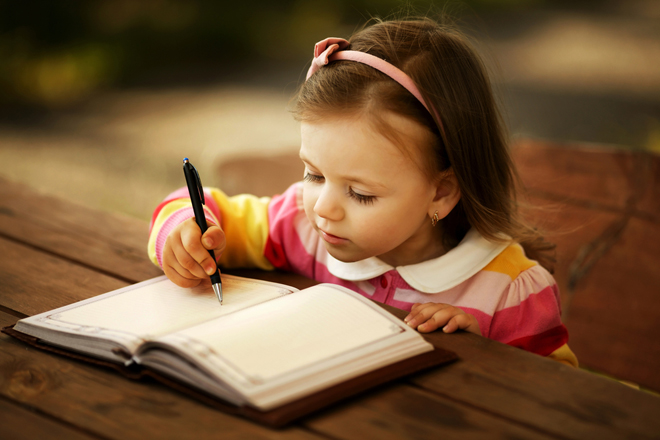 small girl writing_660pix